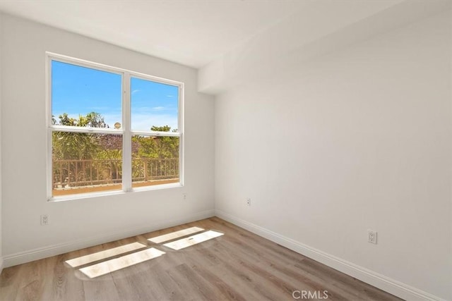 89 E Commonwealth Ave Unit 1I, Alhambra, CA 91801 - empty room featuring wood finished floors and baseboards