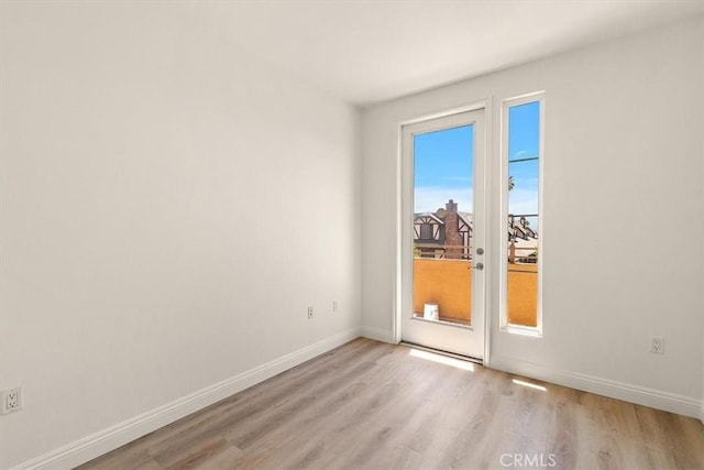89 E Commonwealth Ave Unit 1I, Alhambra, CA 91801 - empty room with light wood-style floors and baseboards