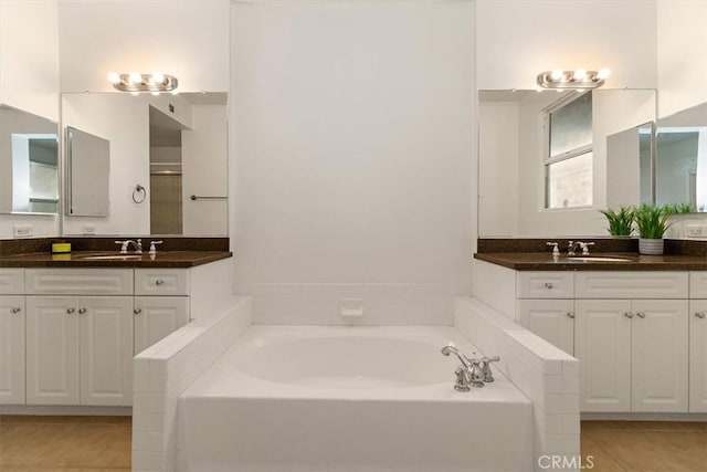 89 E Commonwealth Ave Unit 1I, Alhambra, CA 91801 - bathroom featuring tile patterned flooring, a bath, and two vanities
