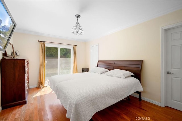 3319 Sparr Blvd, Glendale, CA 91208 - bedroom with access to exterior, baseboards, wood finished floors, and ornamental molding