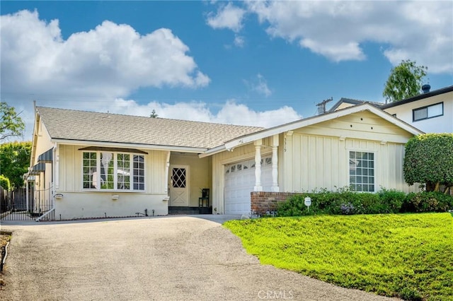 3319 Sparr Blvd, Glendale, CA 91208 - view of front of house featuring board and batten siding, driveway, an attached garage, and roof with shingles