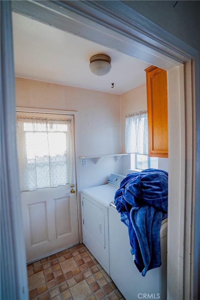 317 N 19th St, Montebello, CA 90640 - laundry area featuring washer and dryer and stone finish floors
