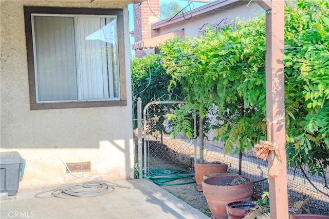 317 N 19th St, Montebello, CA 90640 - view of patio / terrace with a gate
