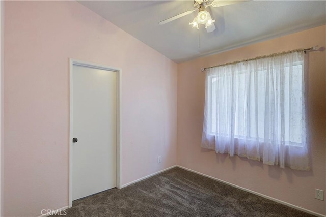 13365 Cloudburst Dr, Corona, CA 92883 - empty room featuring a ceiling fan and dark colored carpet