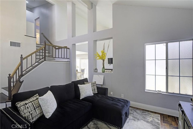 13365 Cloudburst Dr, Corona, CA 92883 - living room with stairway, a towering ceiling, and wood finished floors