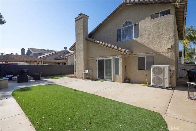 13365 Cloudburst Dr, Corona, CA 92883 - back of house with stucco siding, a patio, a fenced backyard, a tile roof, and a chimney