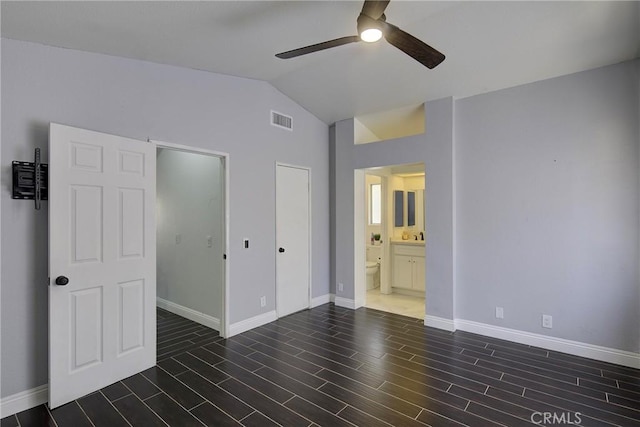 13365 Cloudburst Dr, Corona, CA 92883 - unfurnished bedroom with vaulted ceiling, wood finished floors, ensuite bath, and a ceiling fan