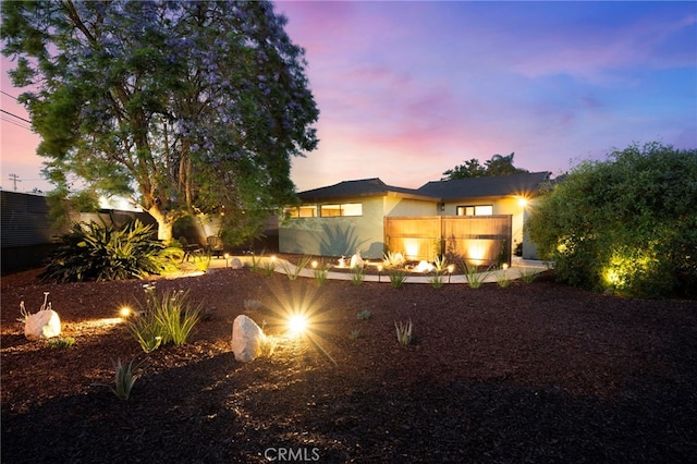 1409 N Midsite Ave, Covina, CA 91722 - back of house at dusk with stucco siding
