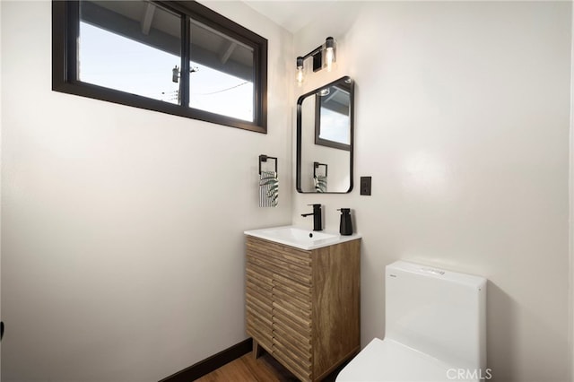 1409 N Midsite Ave, Covina, CA 91722 - bathroom with vanity, toilet, and wood finished floors