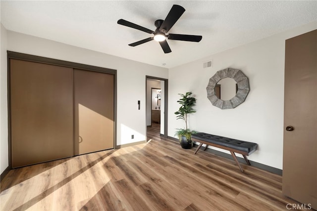 1409 N Midsite Ave, Covina, CA 91722 - bedroom featuring light wood-type flooring, baseboards, and a textured ceiling