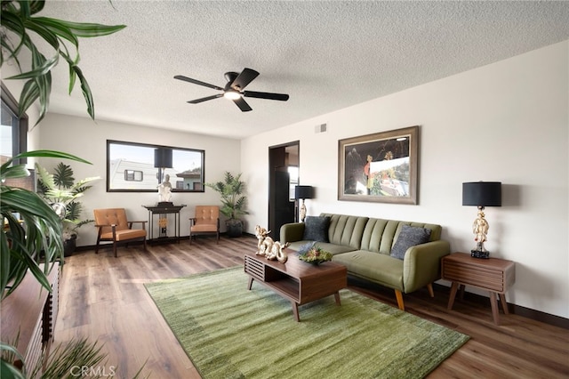 1409 N Midsite Ave, Covina, CA 91722 - living room with ceiling fan, baseboards, wood finished floors, and a textured ceiling