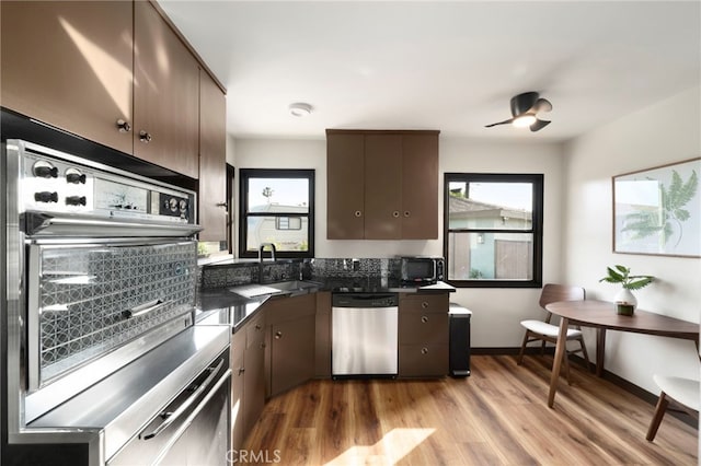 1409 N Midsite Ave, Covina, CA 91722 - kitchen featuring dishwasher, healthy amount of natural light, a sink, and light wood finished floors