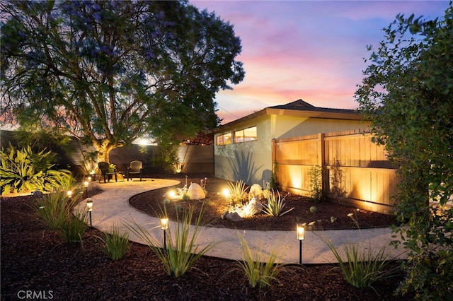 1409 N Midsite Ave, Covina, CA 91722 - yard at dusk with a fenced backyard and a patio