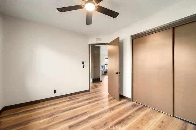 1409 N Midsite Ave, Covina, CA 91722 - unfurnished bedroom with a closet, light wood-style flooring, a ceiling fan, and baseboards