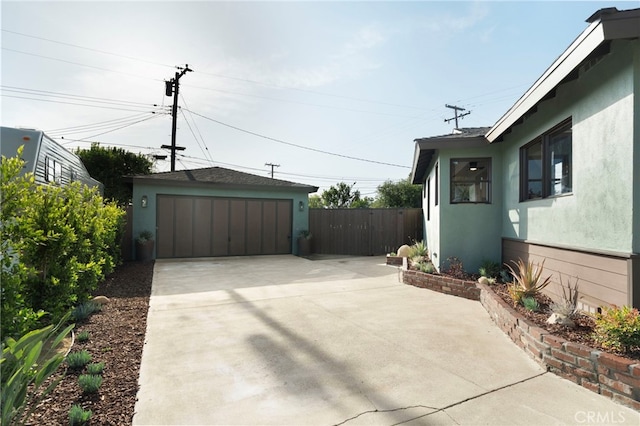 1409 N Midsite Ave, Covina, CA 91722 - view of patio featuring a garage and an outbuilding