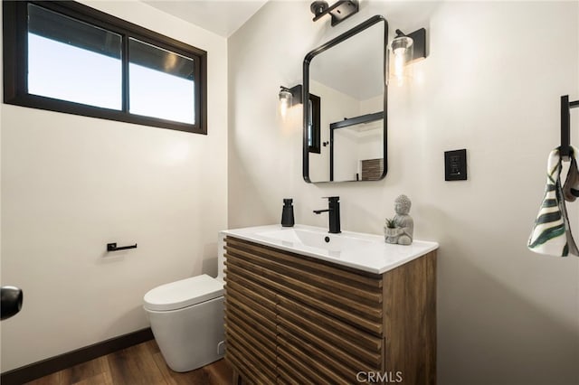1409 N Midsite Ave, Covina, CA 91722 - bathroom with vanity, wood finished floors, toilet, and baseboards