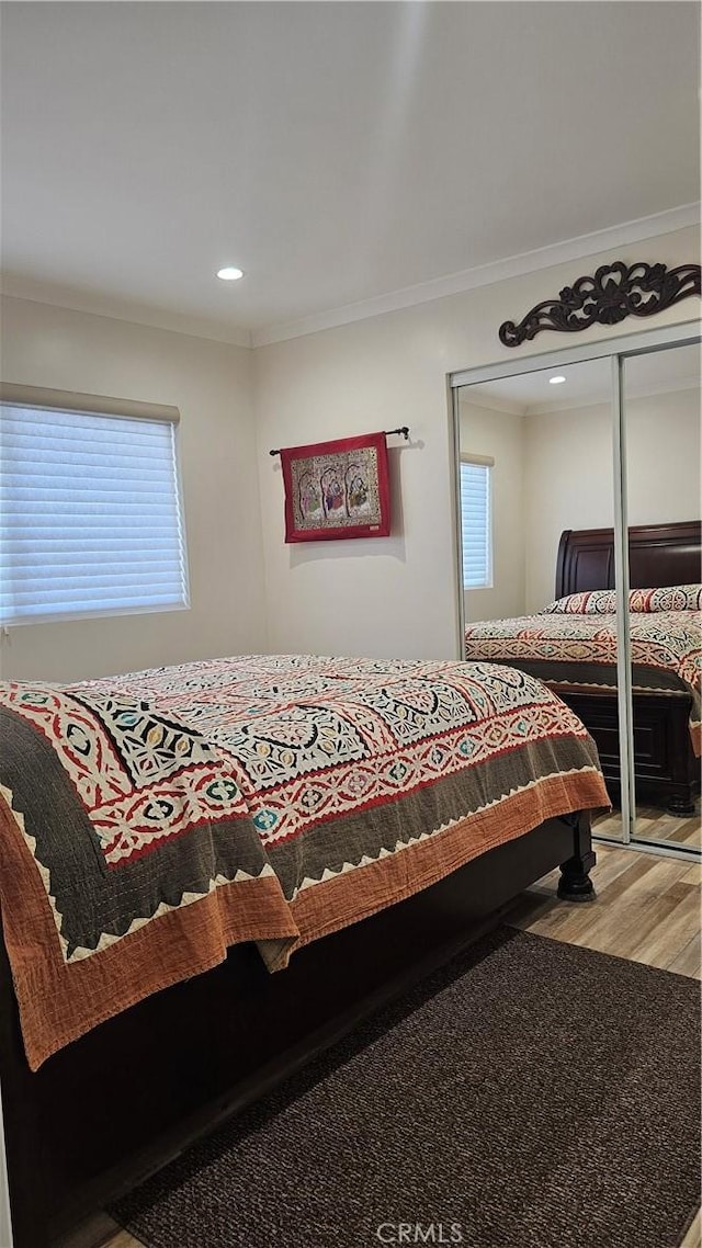 10407 Danube Ave, Granada Hills, CA 91344 - bedroom with wood finished floors, ornamental molding, a closet, and recessed lighting