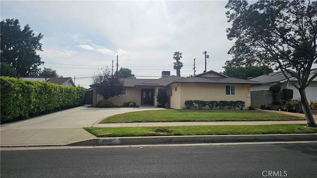 10407 Danube Ave, Granada Hills, CA 91344 - ranch-style home with driveway, a front yard, and stucco siding