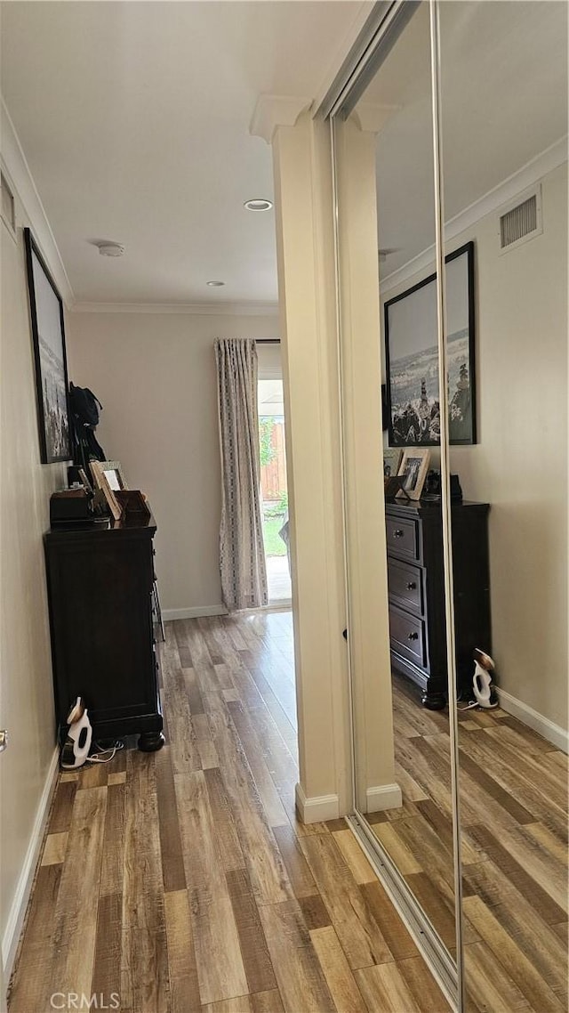 10407 Danube Ave, Granada Hills, CA 91344 - hall featuring wood finished floors, crown molding, baseboards, and an office area