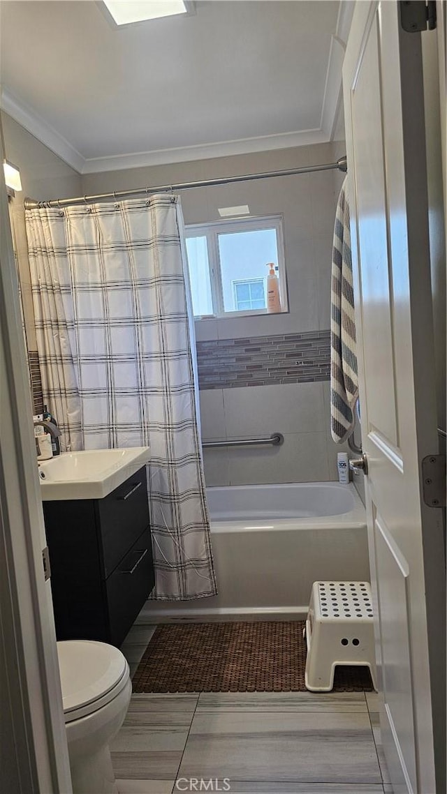 10407 Danube Ave, Granada Hills, CA 91344 - bathroom featuring vanity, ornamental molding, toilet, shower / bath combo, and tile patterned floors