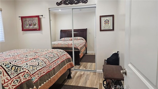 10407 Danube Ave, Granada Hills, CA 91344 - bedroom featuring wood finished floors, baseboards, and a closet