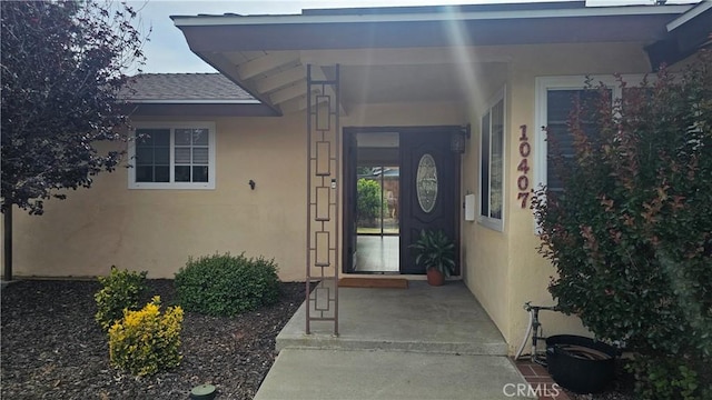 10407 Danube Ave, Granada Hills, CA 91344 - entrance to property with stucco siding and a shingled roof