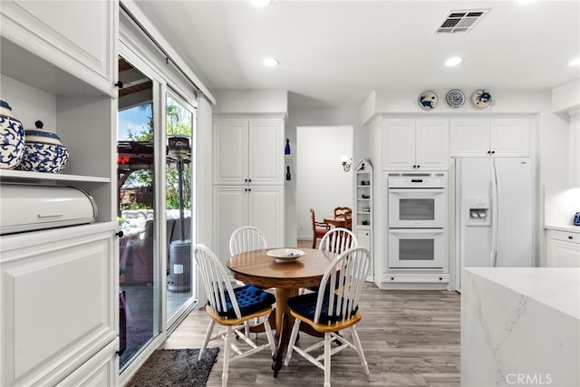 28809 Garnet Canyon Dr, Saugus, CA 91390 - dining space with light wood-style floors and recessed lighting