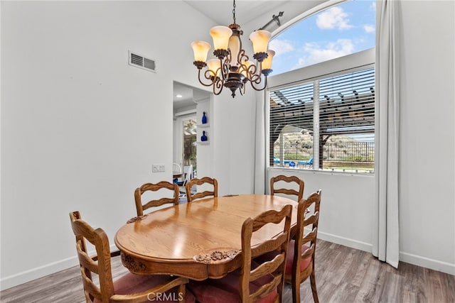 28809 Garnet Canyon Dr, Saugus, CA 91390 - dining room featuring a chandelier, light wood finished floors, and baseboards