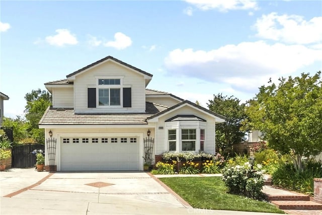 28809 Garnet Canyon Dr, Saugus, CA 91390 - traditional-style house featuring concrete driveway and an attached garage