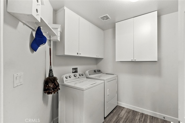 28809 Garnet Canyon Dr, Saugus, CA 91390 - laundry room featuring cabinet space, washer and dryer, dark wood finished floors, and baseboards