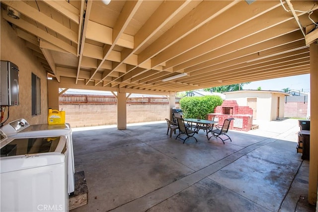 14127 Daubert St, San Fernando, CA 91340 - fenced backyard with separate washer and dryer, outdoor dining area, and a patio area