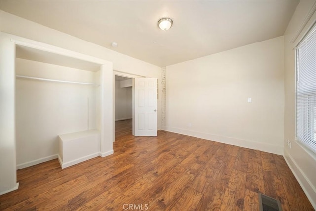 8740 El Camino Real Unit A, Atascadero, CA 93422 - unfurnished bedroom featuring wood finished floors, baseboards, and a closet