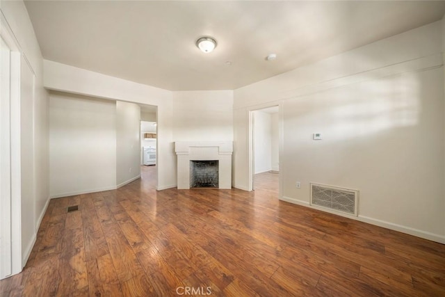 8740 El Camino Real Unit A, Atascadero, CA 93422 - unfurnished living room featuring hardwood / wood-style flooring, a fireplace, and baseboards