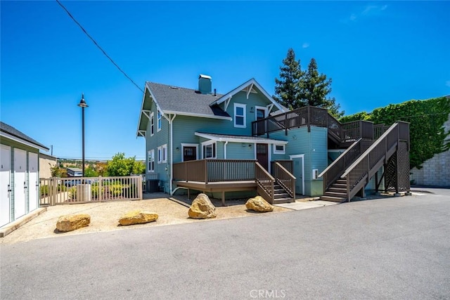 8740 El Camino Real Unit A, Atascadero, CA 93422 - view of front of home featuring a deck, stairway, and a chimney
