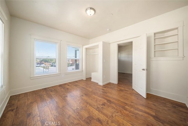 8740 El Camino Real Unit A, Atascadero, CA 93422 - unfurnished bedroom featuring baseboards and wood finished floors