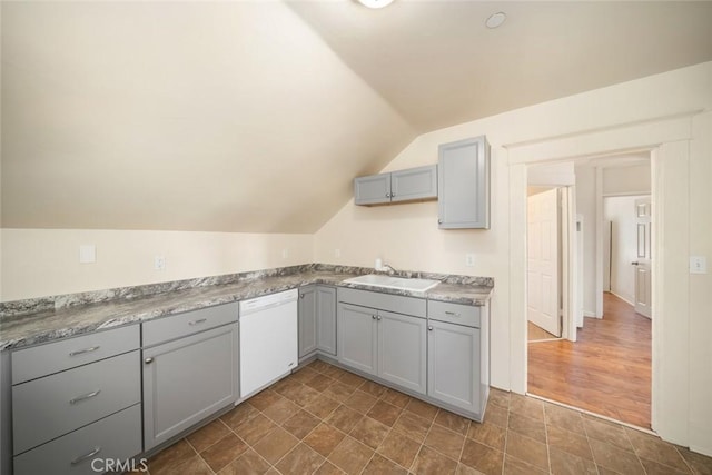 8740 El Camino Real Unit A, Atascadero, CA 93422 - kitchen featuring white dishwasher, gray cabinets, a sink, lofted ceiling, and light countertops