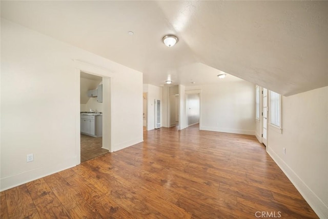 8740 El Camino Real Unit A, Atascadero, CA 93422 - unfurnished living room featuring wood finished floors, baseboards, and a sink