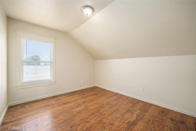 8740 El Camino Real Unit A, Atascadero, CA 93422 - additional living space with wood finished floors, vaulted ceiling, and baseboards