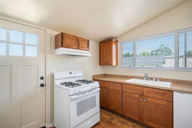 8740 El Camino Real Unit A, Atascadero, CA 93422 - kitchen featuring white appliances, under cabinet range hood, a sink, brown cabinetry, and lofted ceiling