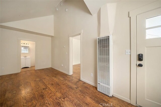 8740 El Camino Real Unit A, Atascadero, CA 93422 - entryway with a heating unit, healthy amount of natural light, wood finished floors, high vaulted ceiling, and baseboards