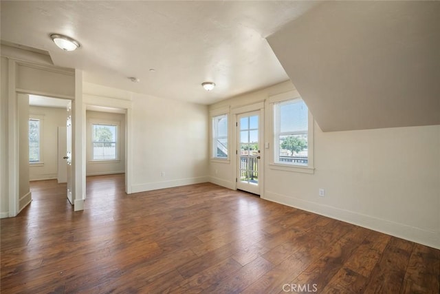8740 El Camino Real Unit A, Atascadero, CA 93422 - unfurnished living room with baseboards and dark wood-type flooring