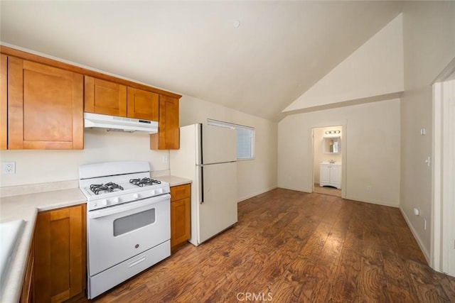 8740 El Camino Real Unit A, Atascadero, CA 93422 - kitchen featuring white appliances, under cabinet range hood, brown cabinetry, wood finished floors, and light countertops