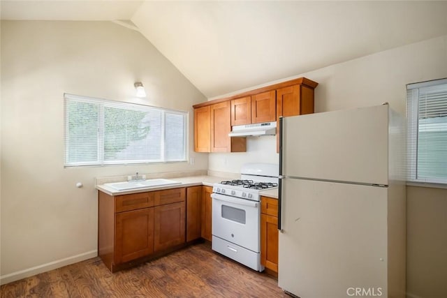 8740 El Camino Real Unit A, Atascadero, CA 93422 - kitchen featuring white appliances, under cabinet range hood, a sink, light countertops, and lofted ceiling