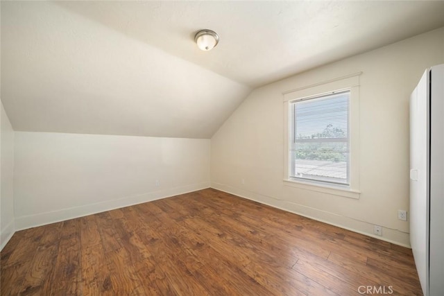 8740 El Camino Real Unit A, Atascadero, CA 93422 - additional living space with vaulted ceiling, baseboards, and wood finished floors