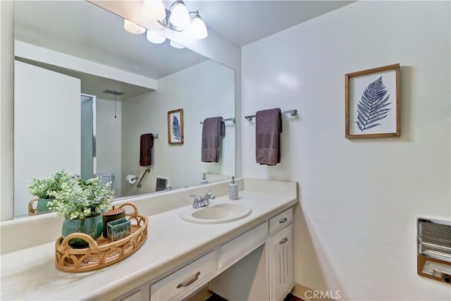 382 Avenida Castilla Unit B, Laguna Woods, CA 92637 - bathroom featuring toilet, vanity, a shower with door, and heating unit