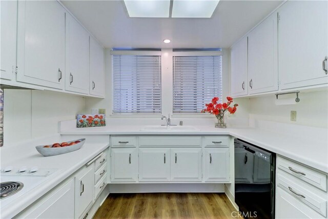 382 Avenida Castilla Unit B, Laguna Woods, CA 92637 - kitchen with black dishwasher, a sink, white cabinetry, light countertops, and recessed lighting