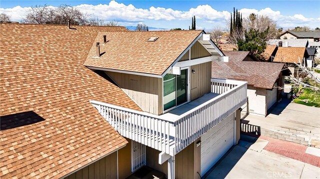 44419 Fenhold, Lancaster, CA 93535 - rear view of house with a shingled roof, a balcony, and a garage