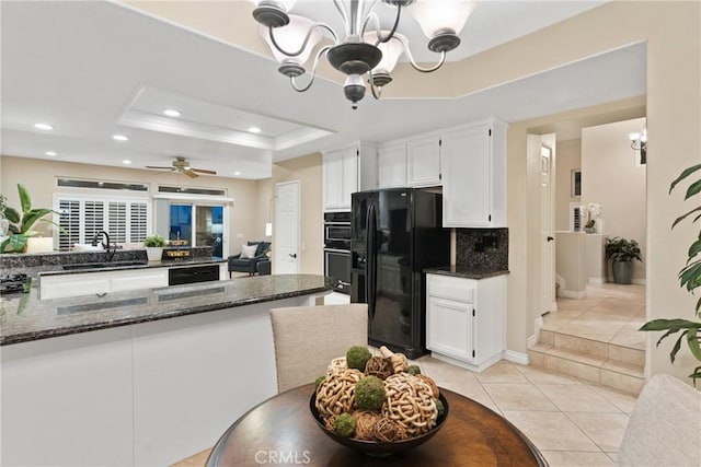 530 S Laureltree Dr, Anaheim Hills, CA 92808 - kitchen with black appliances, a chandelier, white cabinetry, a raised ceiling, and recessed lighting