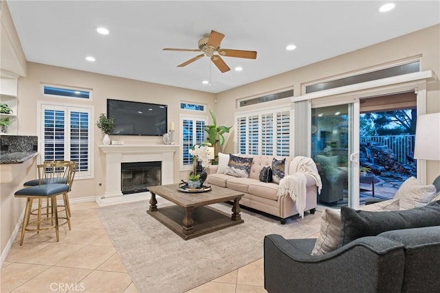 530 S Laureltree Dr, Anaheim Hills, CA 92808 - living room with a ceiling fan, light tile patterned floors, recessed lighting, and a glass covered fireplace