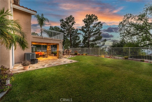530 S Laureltree Dr, Anaheim Hills, CA 92808 - yard at dusk with a balcony, a fenced backyard, a patio area, and an outdoor hangout area